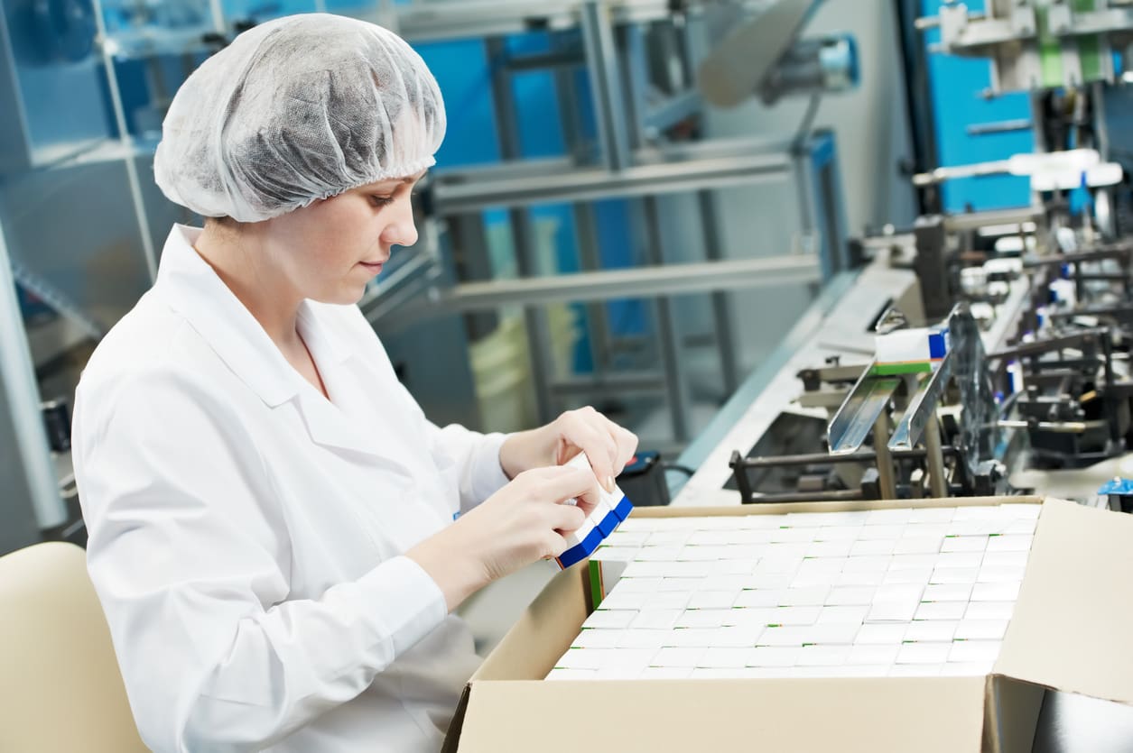 Pharmaceutical factory worker Inspecting and packaging medicines